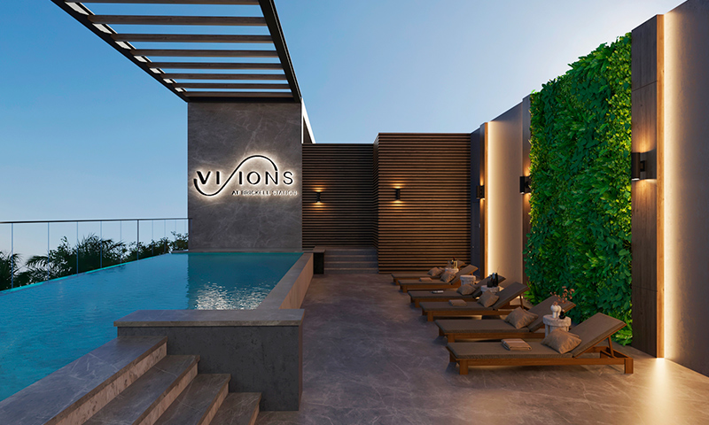 Rooftop pool at Visions at Brickell with city skyline views.
